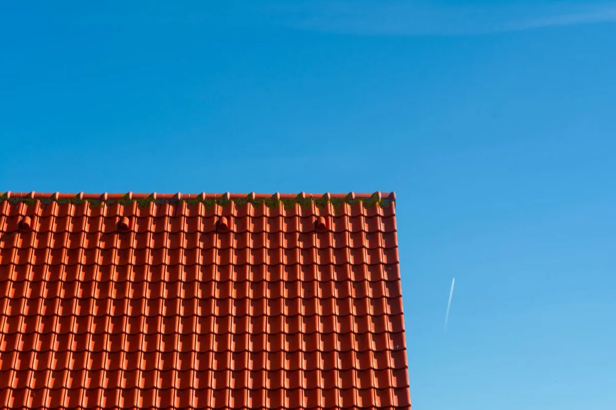 Tile roof gable in full sun, the kind of exposure that sets roof life in Denver, CO